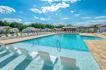 Two heated saltwater pools with sundeck & lounge ledge